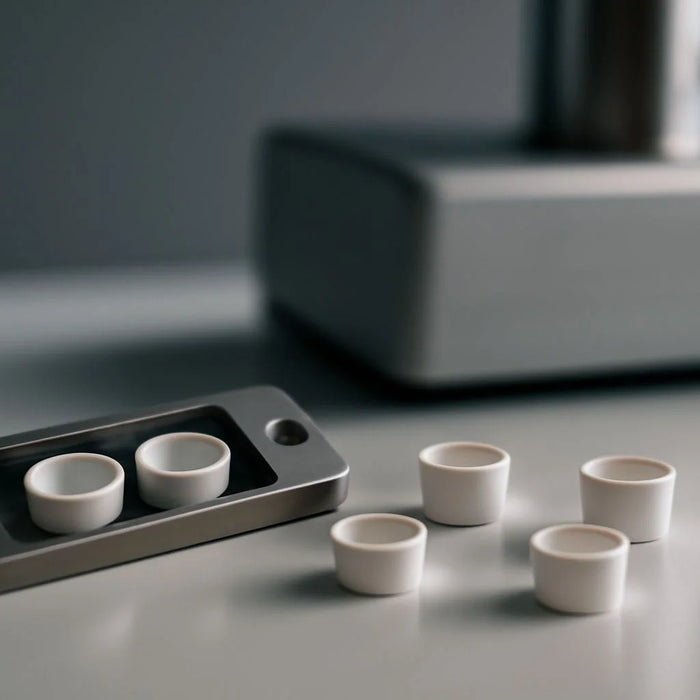 Alumina sample pans for thermal analysis, designed for precision in TGA and DSC experiments under high temperatures.