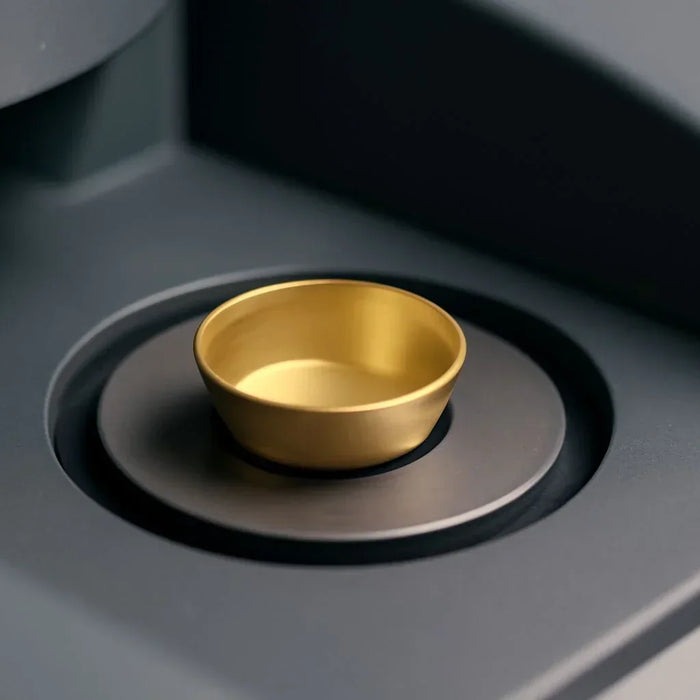 DSC sample pans used in thermal analysis with materials like aluminum, platinum, and ceramic for high-precision results.