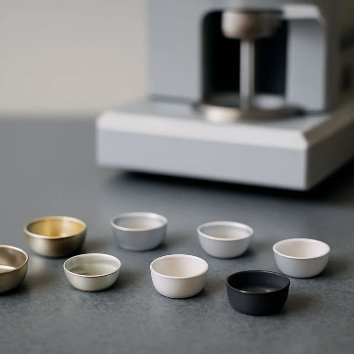 Thermal analysis sample tray showcasing material options for precise testing
